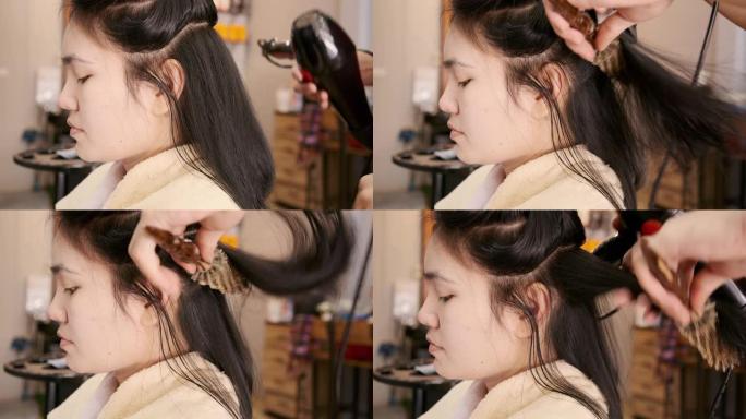 亚洲美女她在沙龙里使用洗发和吹发服务。