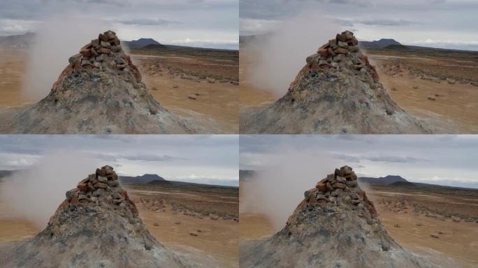 热蒸汽在崎的火山山坡上逸出岩石堆