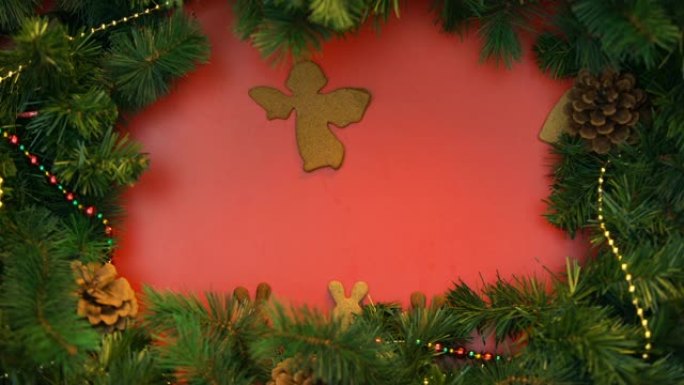 天使，兔子和心形饼干在节日背景下移动，圣诞节