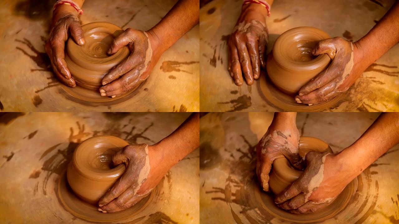 工作中的波特制作陶瓷盘子。印度，拉贾斯坦邦。