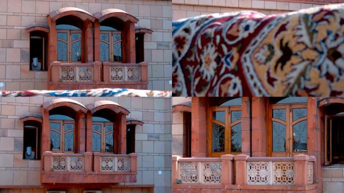 在传统的印度风格阳台上，建筑物内有遮阳板和窗户