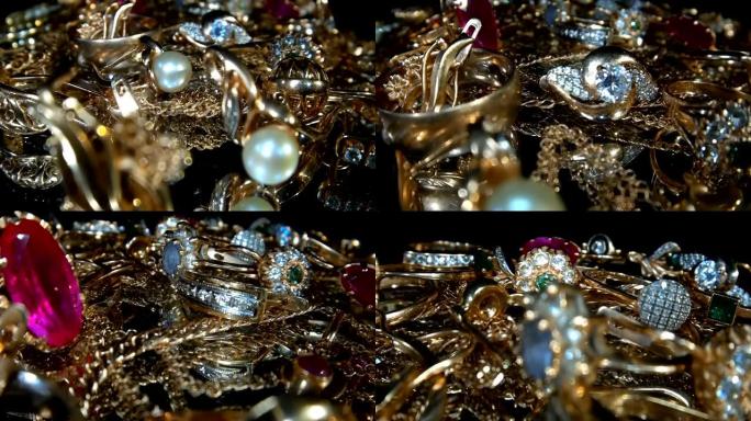 美丽的闪亮，闪闪发光的金色珠宝在玻璃表面与眩光的宝石