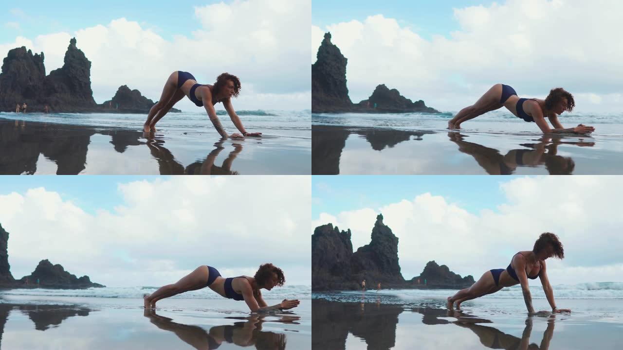 健身女性力量训练做经典传统肘板又称前臂板。女孩训练身体核心肌肉和腹肌。运动员在海滩上进行户外训练