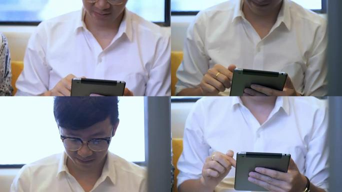 在火车上使用数字平板电脑的人