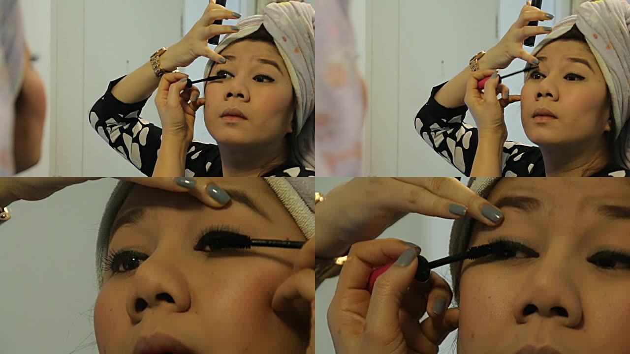 女人使用眼线笔化妆美容