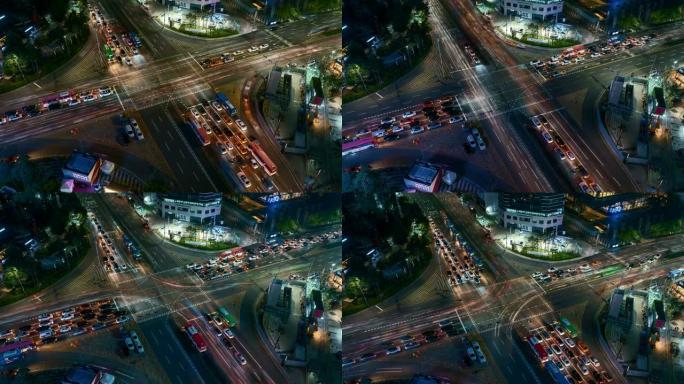 在韩国首尔市首尔江南中心商业区的十字路口，光线小径的延时夜景交通速度加快。