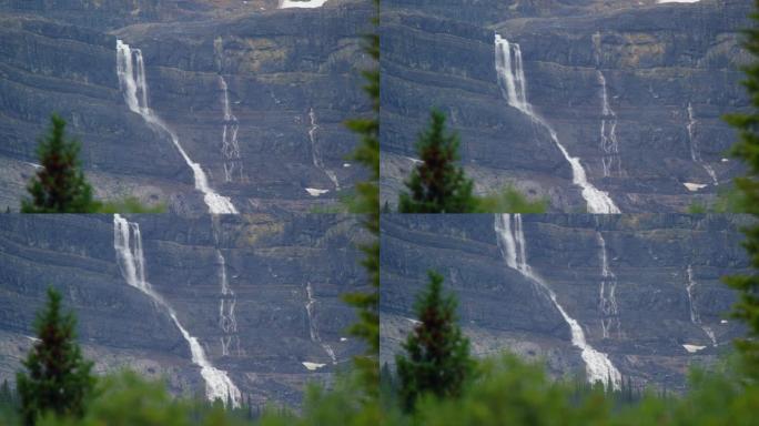 加拿大艾伯塔省贾斯珀国家公园加拿大落基山脉森林和瀑布的机架焦点照片