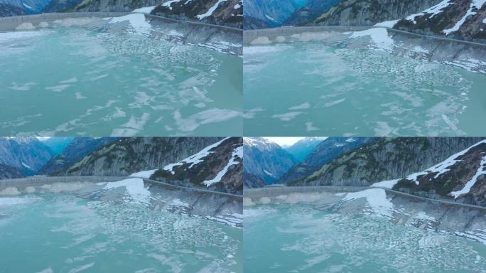 空中无人机拍摄了山区大坝上的冰镇
