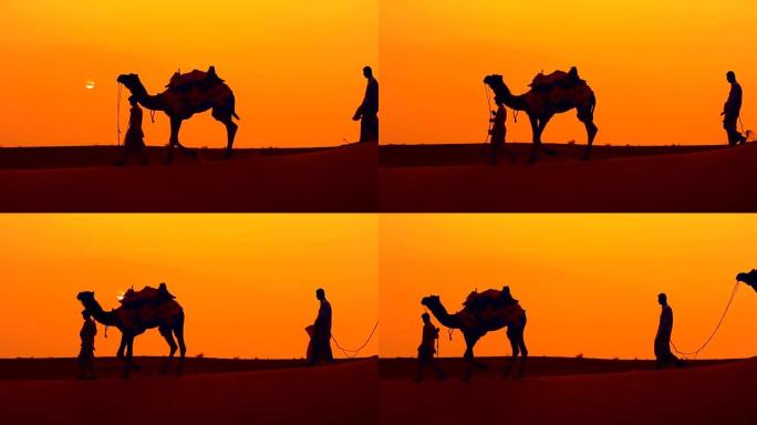 骑乘者，日落时的骆驼司机。印度拉贾斯坦邦，日落时的塔尔沙漠。