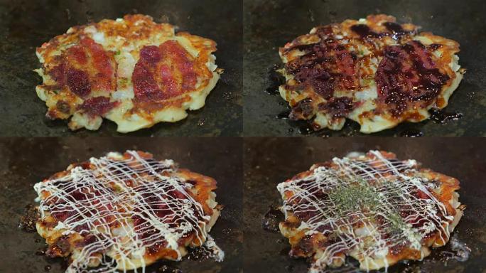 在铁板烧锅上制作okonomiyaki。前视图。