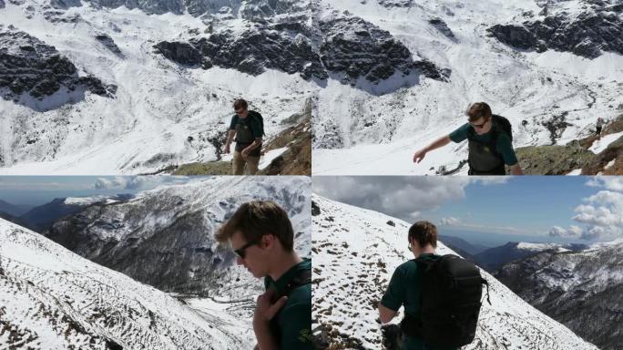 男性徒步旅行者穿越雪山壁架