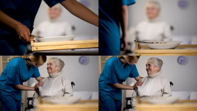 年轻护士为老残障女士提供晚餐，照顾病人