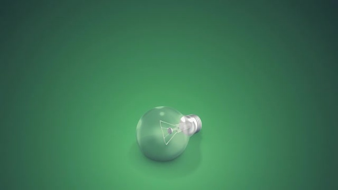 绿色背景上的灯泡绿色背景灯泡闪烁