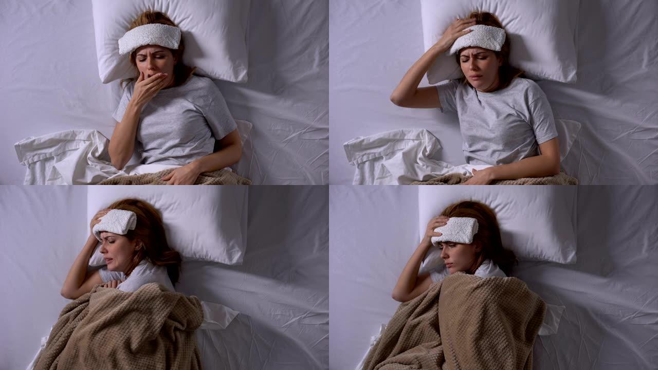 生病的女孩咳嗽，躺在床上，额头湿敷，季节性流感