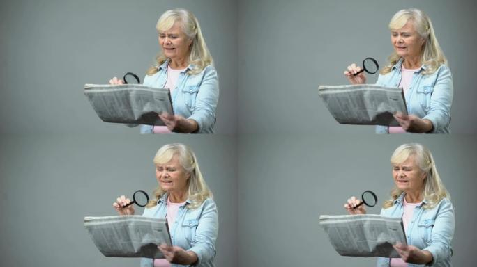 试图用放大镜阅读报纸的老太太，视力不佳