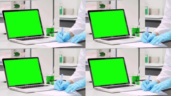 科学家正在用绿屏笔记本电脑写笔记