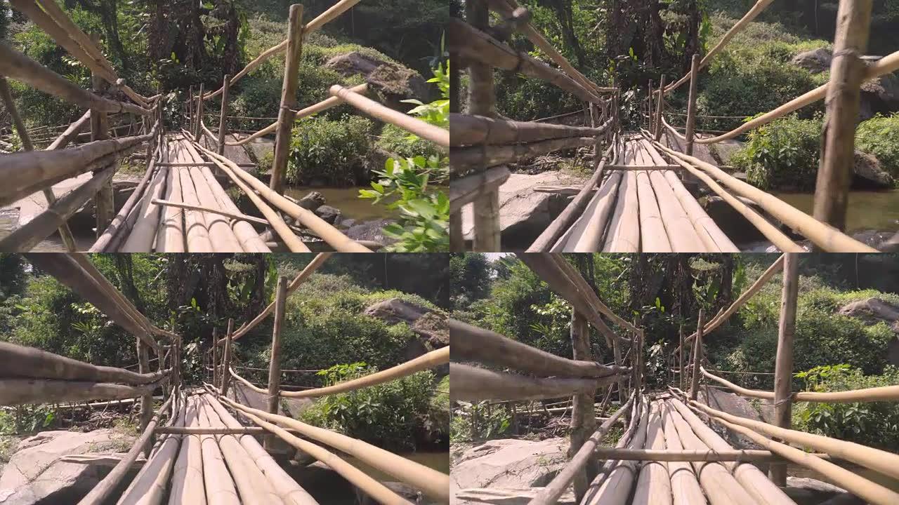低角度视图: 走在竹制的桥上