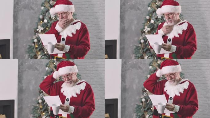 体贴的白人老人穿着圣诞老人服装读信，抚摸着白胡子，挠头。圣诞老人在除夕夜检查信件。电影院4k Pro