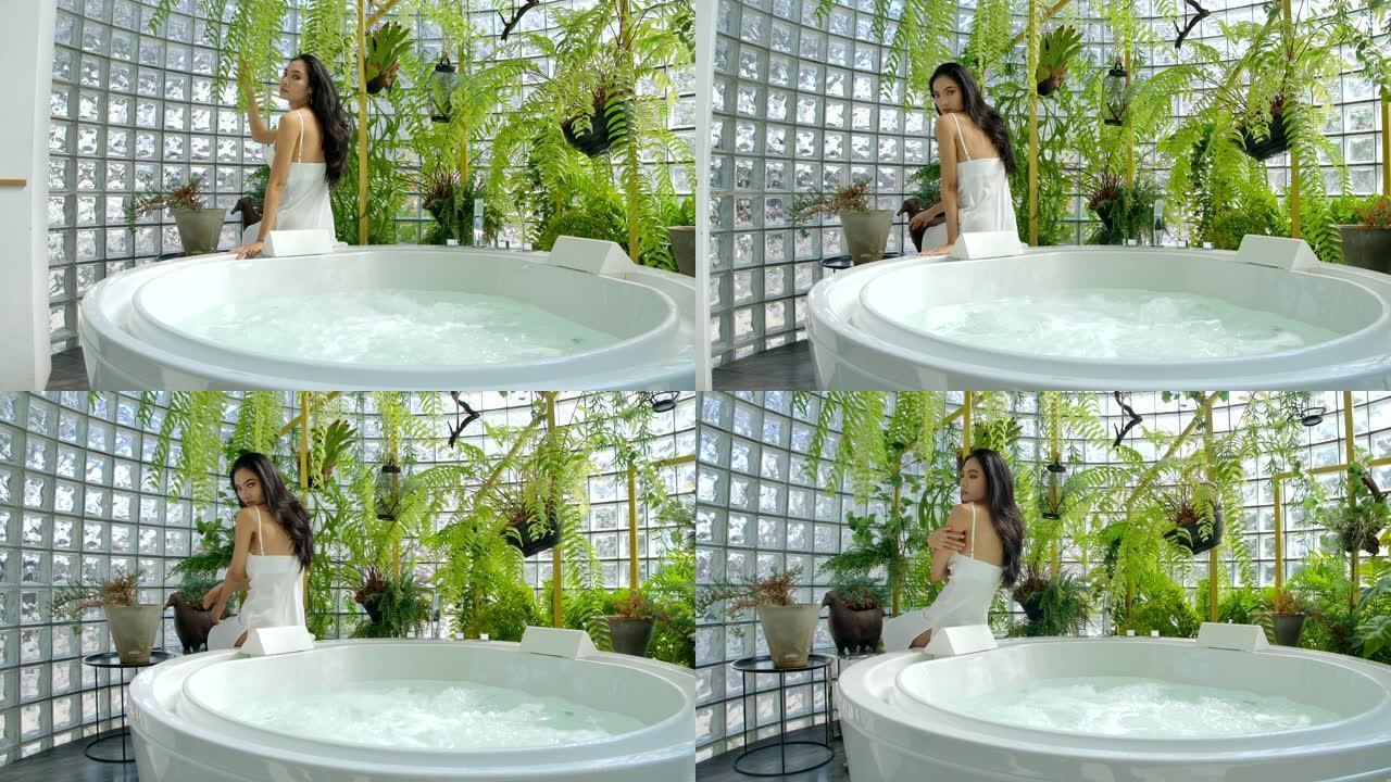 4k慢动作年轻女性在豪华浴缸区性感姿势