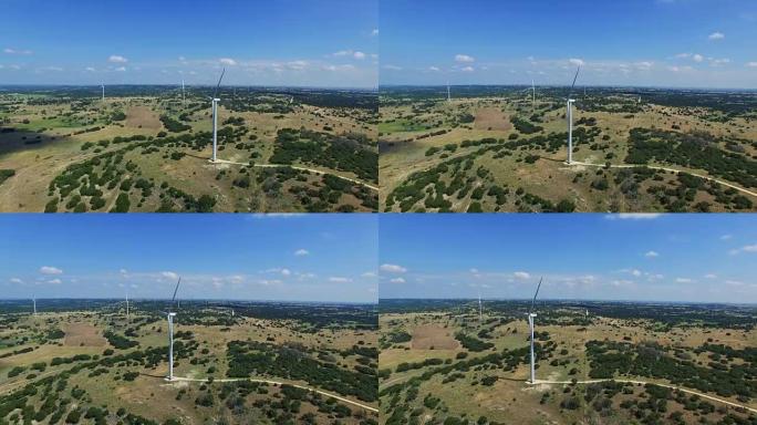 令人惊叹的德克萨斯山乡村发现了涡轮机，俯瞰着空中无人机射击的风力涡轮机农场，位于德克萨斯州戈德斯韦特