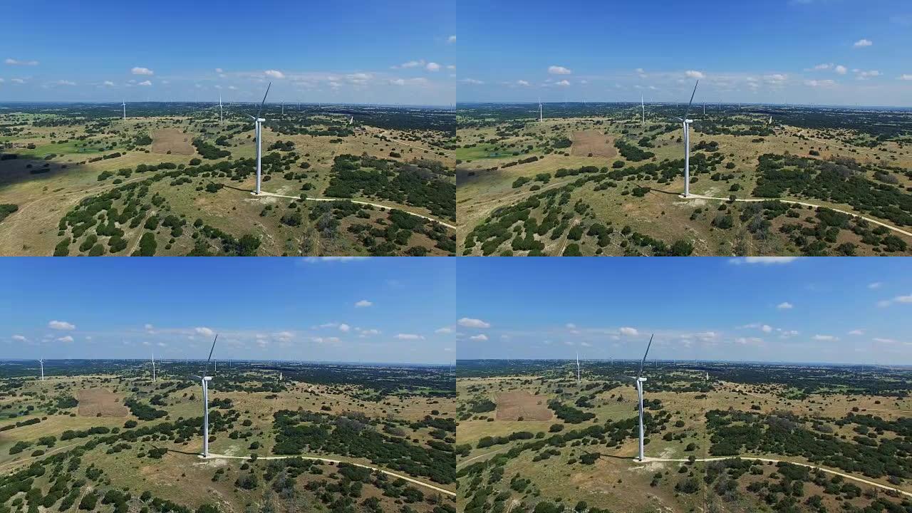 令人惊叹的德克萨斯山乡村发现了涡轮机，俯瞰着空中无人机射击的风力涡轮机农场，位于德克萨斯州戈德斯韦特