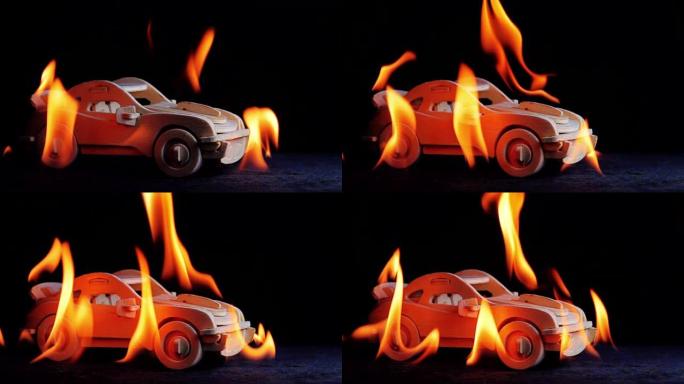 在燃烧的背景上燃烧玩具车，慢动作
