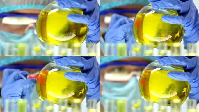 实验室工作人员用尿液标记烧瓶，健康和疾病研究，分析