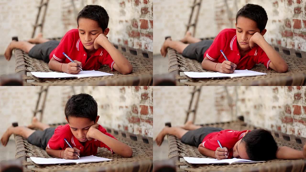 小学学生在家学习贫困家庭小孩写作业疲倦不