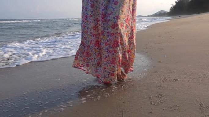 高清慢动作: 美丽的女人走在沙滩上