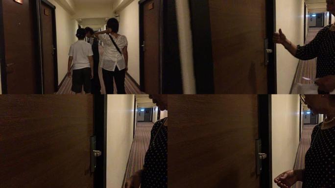 亚洲家庭在酒店大厅散步