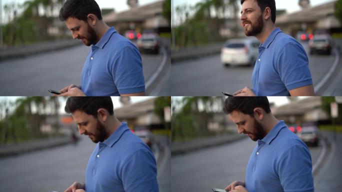 男人使用智能手机并等待汽车