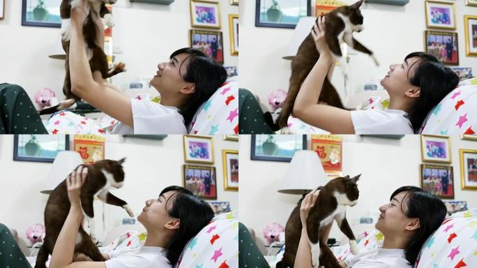 亚洲女孩在家抱着她的猫