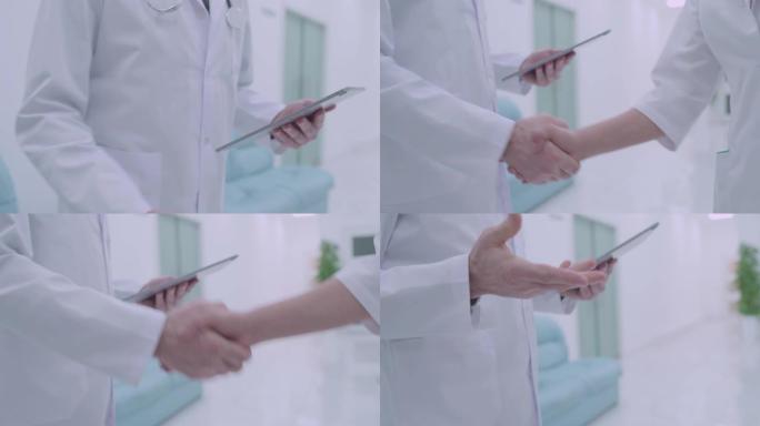 身穿白大褂的医务同仁握手工作合作协议