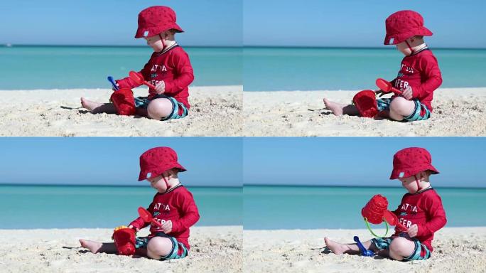 古巴Cayo热带海滩上的婴儿男孩玩耍