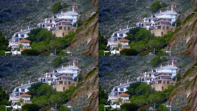 沿海城市附近山腰上的一栋漂亮房子给人一种最好的风景