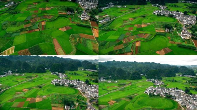 贵州喀斯特峰林 (万峰林) 村庄和稻田的鸟瞰图。