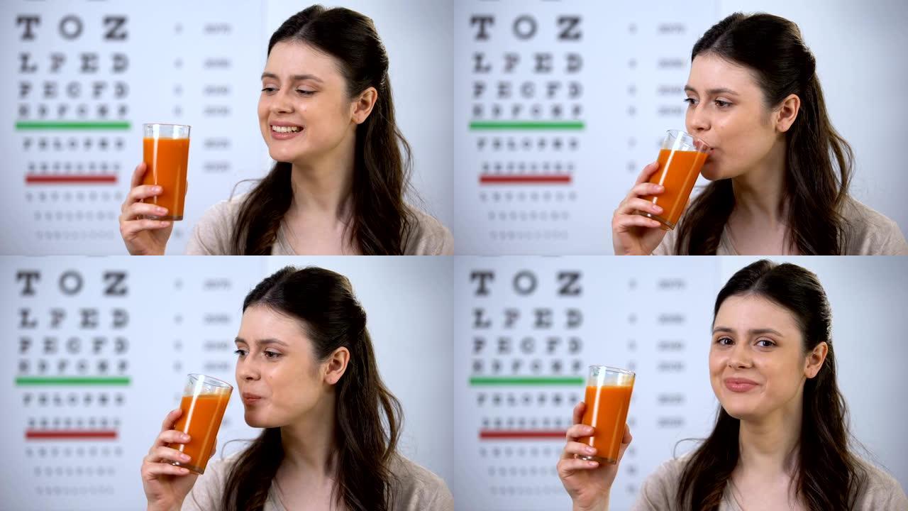 快乐的女人喝健康的新鲜胡萝卜汁，背景图，视觉