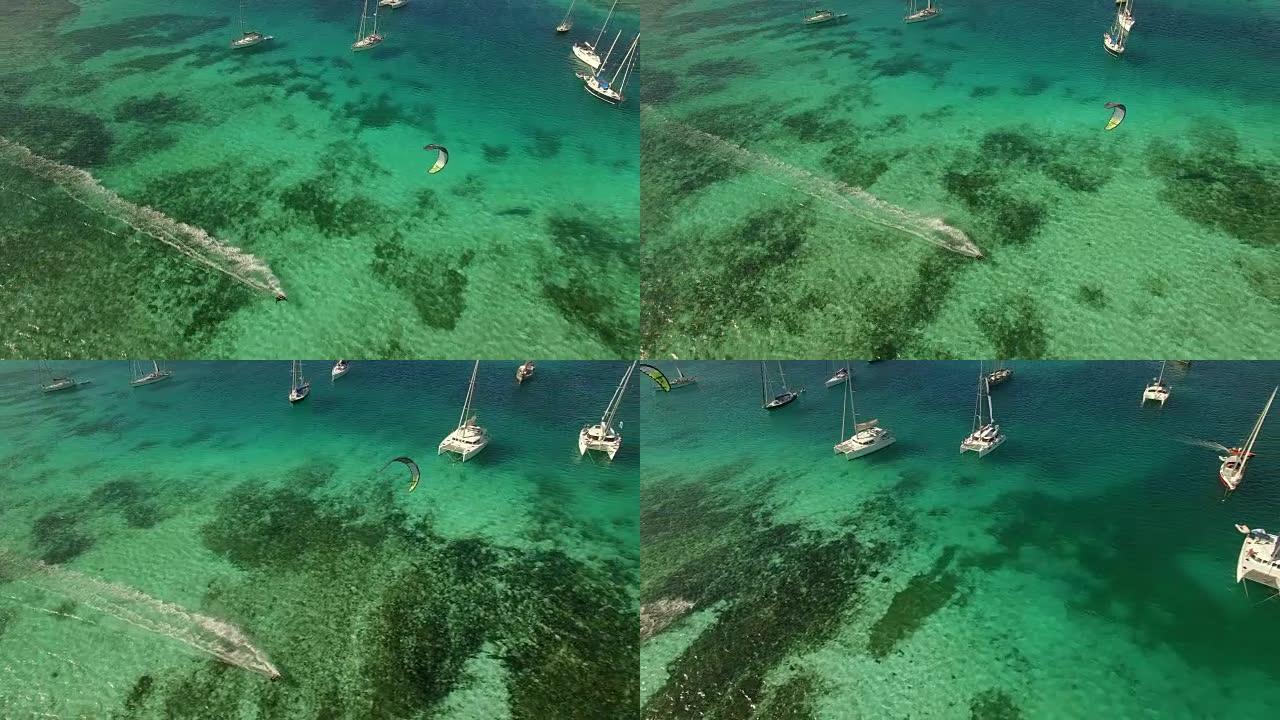 联合岛加勒比海平坦水面上的风筝冲浪者的航拍