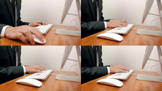 商人在笔记本电脑上打字