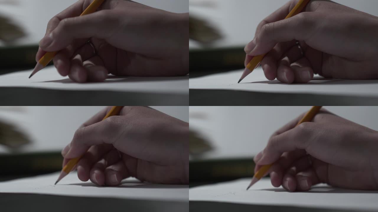 美丽温柔的女性用铅笔在白纸上写字。