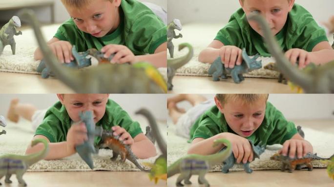 玩玩具恐龙的小男孩