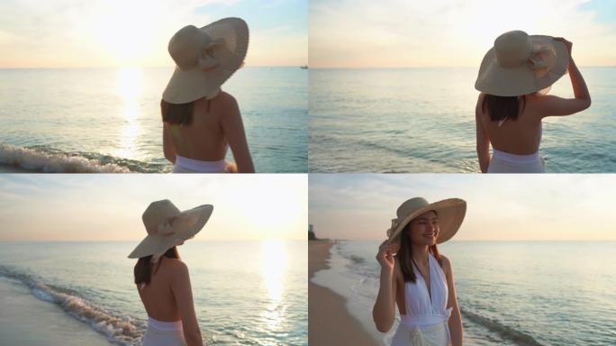 4k镜头亚洲旅游女孩在海滩上。她早上穿泳衣。