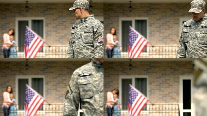 悲伤的军人离开家看着妻子和女儿拥抱背景，职责