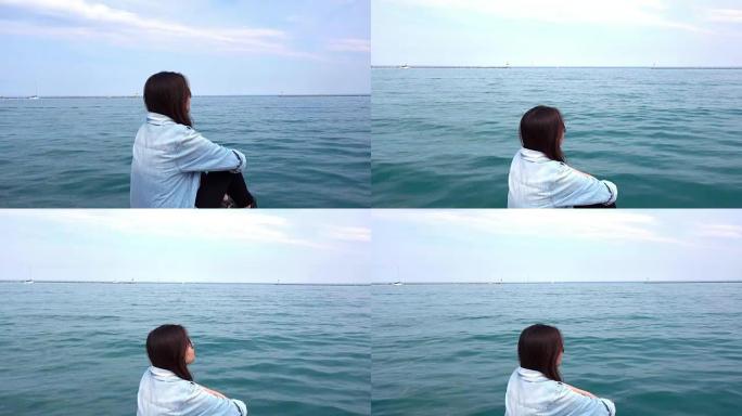 美国伊利诺伊州芝加哥，密歇根湖背景的亚洲女性放松