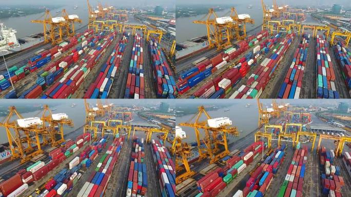 船厂带工作起重机桥的鸟瞰式集装箱货运船