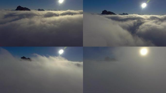 空中: 在美丽的云层中越过高山