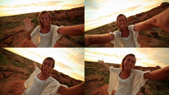 女孩在日出时以壮观的风景拍摄自拍肖像