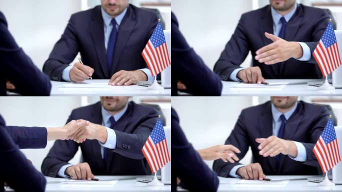 美国正式签署国际合作合同，与合作伙伴握手