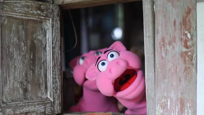 粉红猪手偶的动作特写镜头实拍