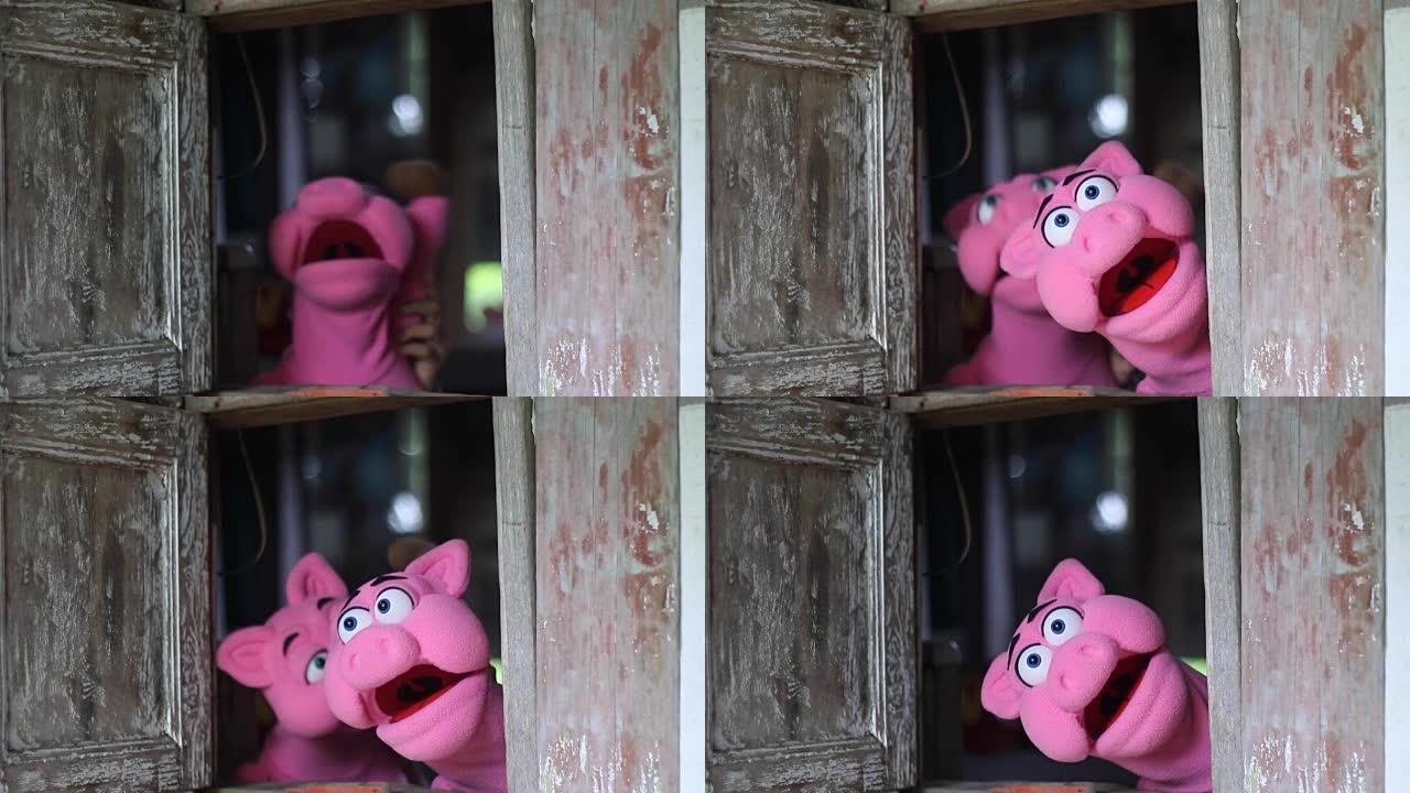 粉红猪手偶的动作特写镜头实拍